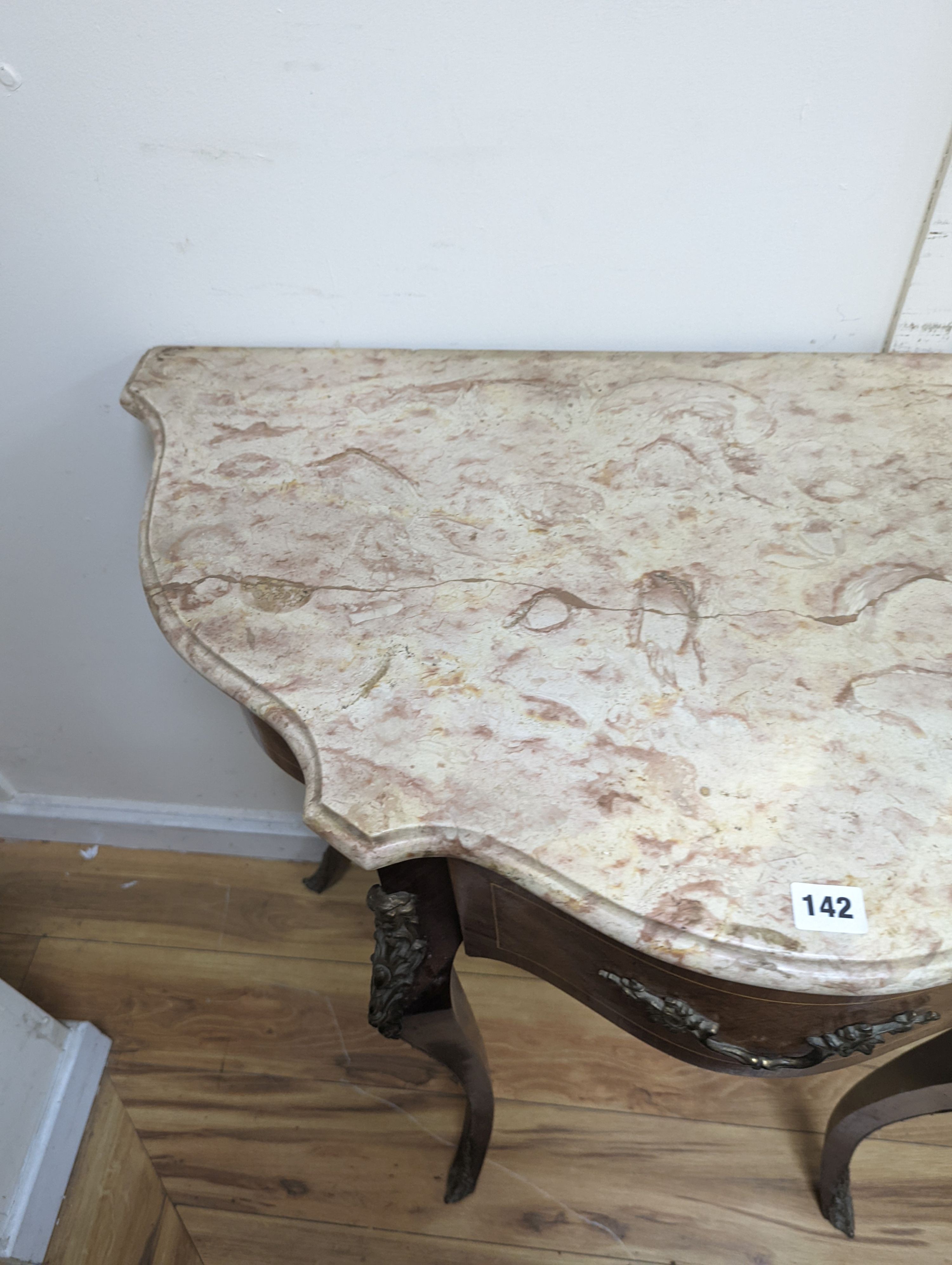 A Louis XVI design marble top serpentine console table. W-102cm, D-47cm, H-91cm.